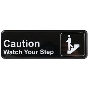 "Caution - Watch Your Step" Black & White Self-Adhesive Sign with Symbol - 9" L x 3" Hgt.