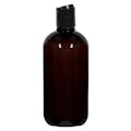 8 oz. Light Amber PET Traditional Boston Round Bottle with 24/410 Black Polypropylene Dispensing Disc-Top Cap