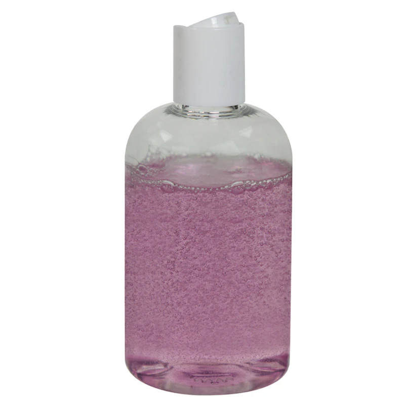 4 oz. Clear PET Squat Boston Round Bottle with 24/410 White Polypropylene Disc-Top Dispensing Cap