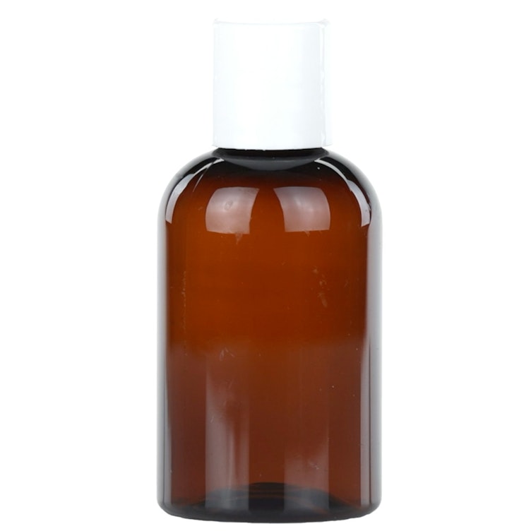 4 oz. Clarified Amber PET Cosmo Round Bottle with 20/410 White Polypropylene Disc-Top Dispensing Cap