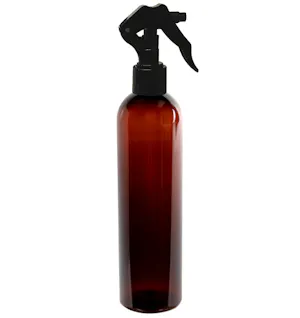 16 oz. Amber PET Cosmo Round Bottle with 24/410 Smooth Black Trigger Sprayer & 0.21mL Output