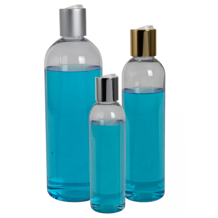 32 oz. Clear PET High Clarity Cosmo Round Bottle with 28/410 Silver & White ABS/Polypropylene Disc-Top Dispensing Cap