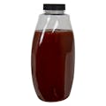 18 oz. Clear PET Inverted Oval Sauce Bottle with 38/400 Black Ribbed Unlined Cap