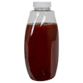 18 oz. Clear PET Inverted Oval Sauce Bottle with 38/400 White Ribbed Cap with F217 Liner