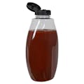 18 oz. Clear PET Inverted Oval Sauce Bottle with 38/400 Black Ribbed Snap-Top Dispensing Cap