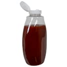 18 oz. Clear PET Inverted Oval Sauce Bottle with 38/400 White Ribbed Snap-Top Dispensing Cap with Pressure-Sensitive Liner