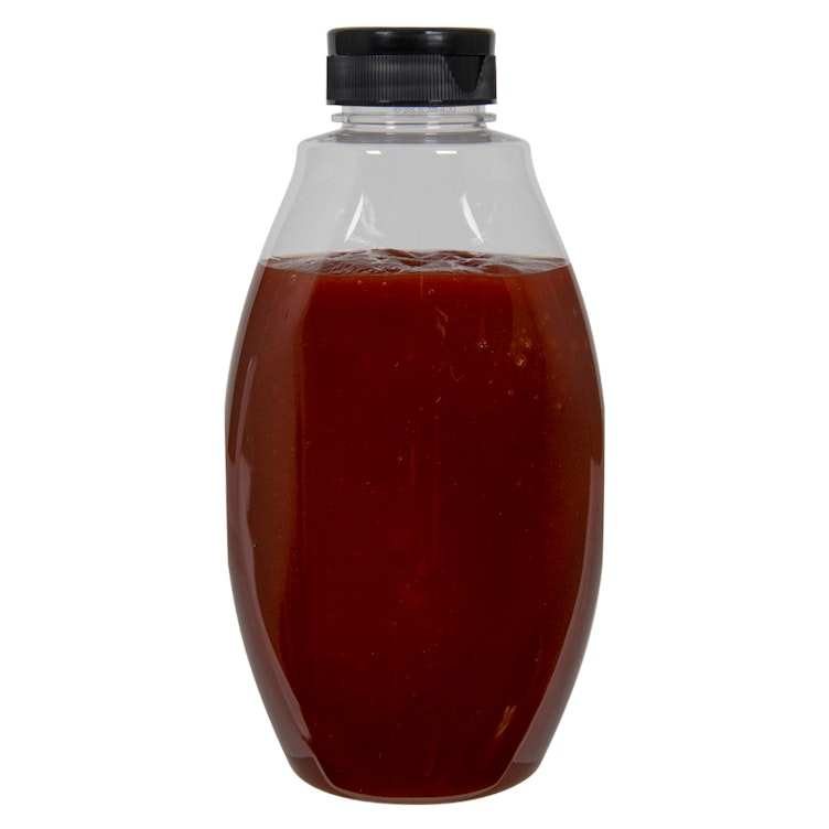 18 oz. Clear PET Inverted Oval Sauce Bottle with 38/400 Black Ribbed Snap-Top Dispensing Cap with Foil Heat Induction Liner