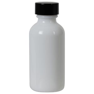 1 oz. White Glass Boston Round Bottle with 20/400 Black Phenolic Cap with Pulp & Vinyl Liner
