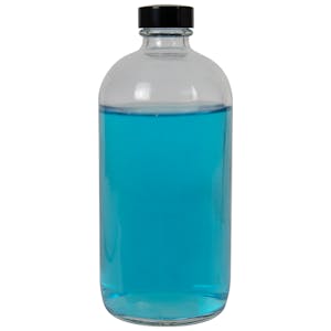 16 oz. Clear Glass Boston Round Bottle with 28/400 Black Phenolic Cap with Pulp & Vinyl Liner