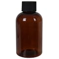 4 oz. Light Amber PET Squat Boston Round Bottle with 24/410 Black Ribbed Cap with F217 Liner