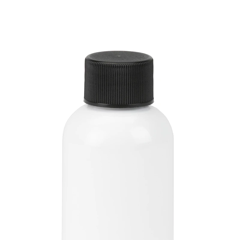 2 oz. White PET Traditional Boston Round Bottle with 20/410 Black Ribbed Cap with F217 Liner