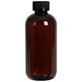 8 oz. Light Amber PET Traditional Boston Round Bottle with 24/400 Black Ribbed CRC Cap with F217 Liner