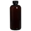 16 oz. Light Amber PET Traditional Boston Round Bottle with 28/400 Black Ribbed CRC Cap with F217 Liner