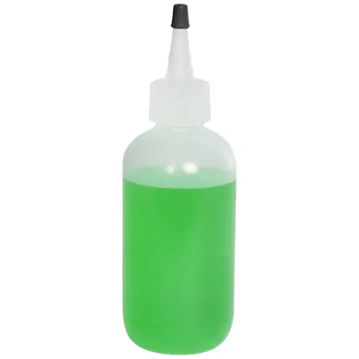 6 oz. Natural LDPE Boston Round Bottle with 24/410 Natural Yorker Dispensing Cap with Regular Black Tip