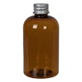 4 oz. Clarified Amber PET Squat Boston Round Bottle with 20/410 Brushed Silver Aluminum Cap with Foam Liner