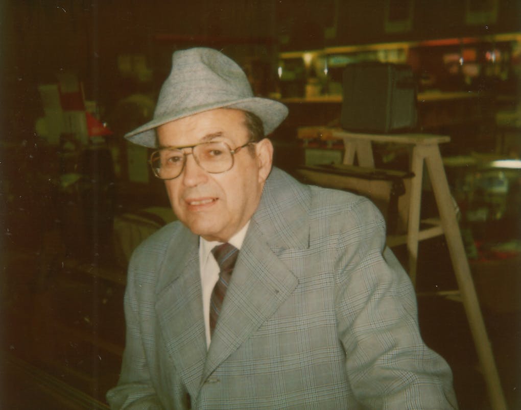 Stanley wearing a gray hat and suit