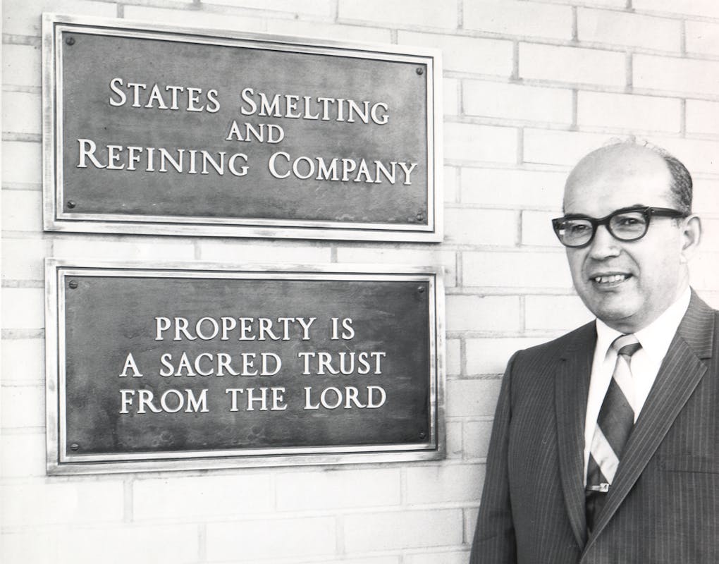 Stanley with wall plaques: "States Smelting and Refining Company" and "Property is a Sacred Trust From The Lord"